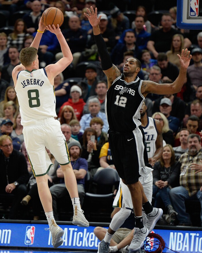 (Francisco Kjolseth  |  The Salt Lake Tribune)  Utah Jazz forward Jonas Jerebko (8) fires one off over San Antonio Spurs forward LaMarcus Aldridge (12) during the first quarter of an NBA basketball game in Salt Lake City, Thursday, Dec. 21, 2017.