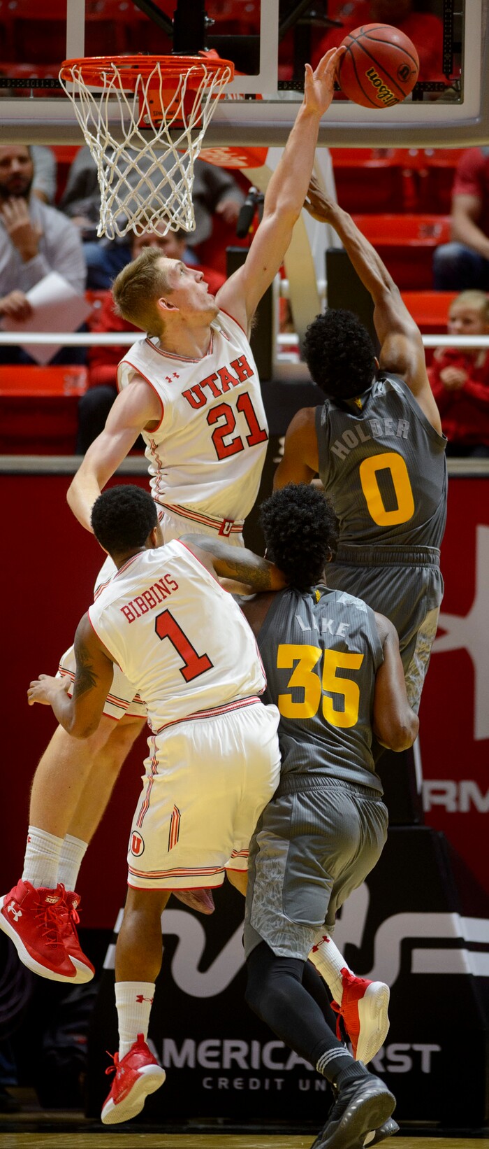 (Steve Griffin  |  The Salt Lake Tribune) Utah Utes forward Tyler Rawson (21) blocks the shot of Arizona State Sun Devils guard Tra Holder (0)during the Utah Utes versus Arizona State Sun Devils at the Huntsman Center on the University of Utah campus in Salt Lake City Sunday January 7, 2018.