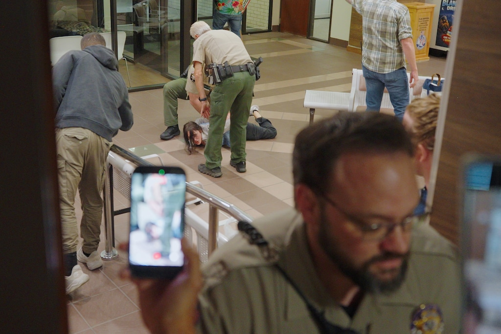 (Screenshot from video by Party for Socialism and Liberation Salt Lake City) A protestor is handcuffed by a Utah County Sheriff’s deputy during a Utah County Planning Commission meeting on data center land use at the Utah County Administration Building in Provo on Tuesday, Oct. 20, 2026.