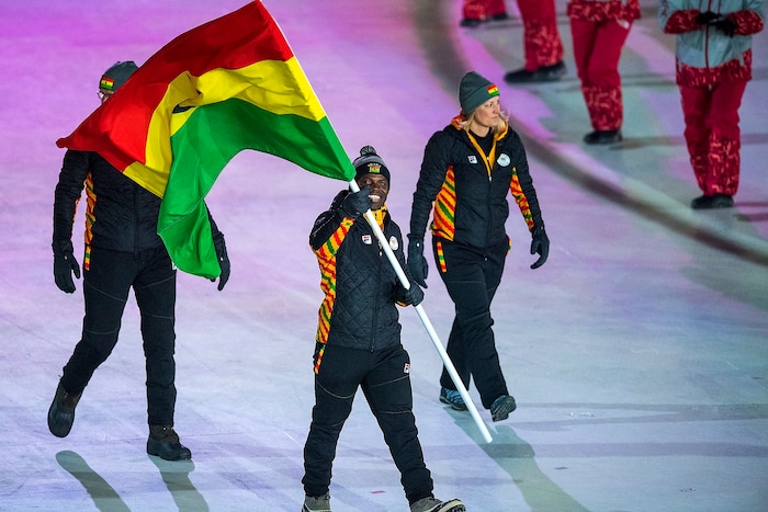 (Chris Detrick | The Salt Lake Tribune) Former Utah Valley University sprinter Akwasi Frimpong carries the flag of Ghana during the Pyeongchang 2018 Winter Olympics opening ceremony at Olympic Stadium Friday, February 9, 2018.