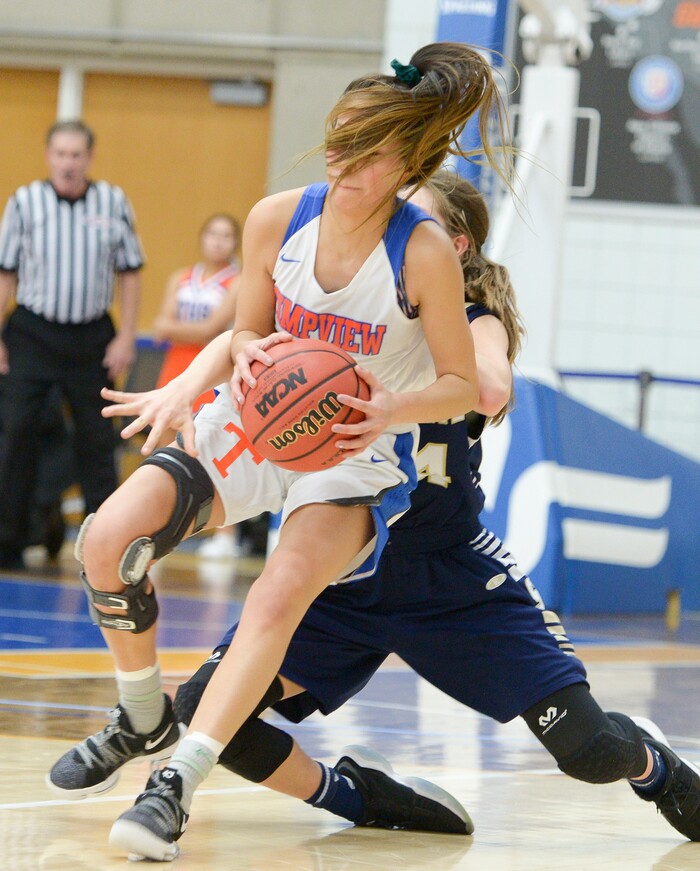 (Leah Hogsten  |  The Salt Lake Tribune) Skyline's Kate Vorwaller (24) brings down Timpview's Jasmine Espinoza (10).  Timpview defeated Skyline 56-49 in their semifinal game of the 5A High School Girls' Basketball Tournament at SLCC in Taylorsville, Friday, Feb. 23, 2018. 