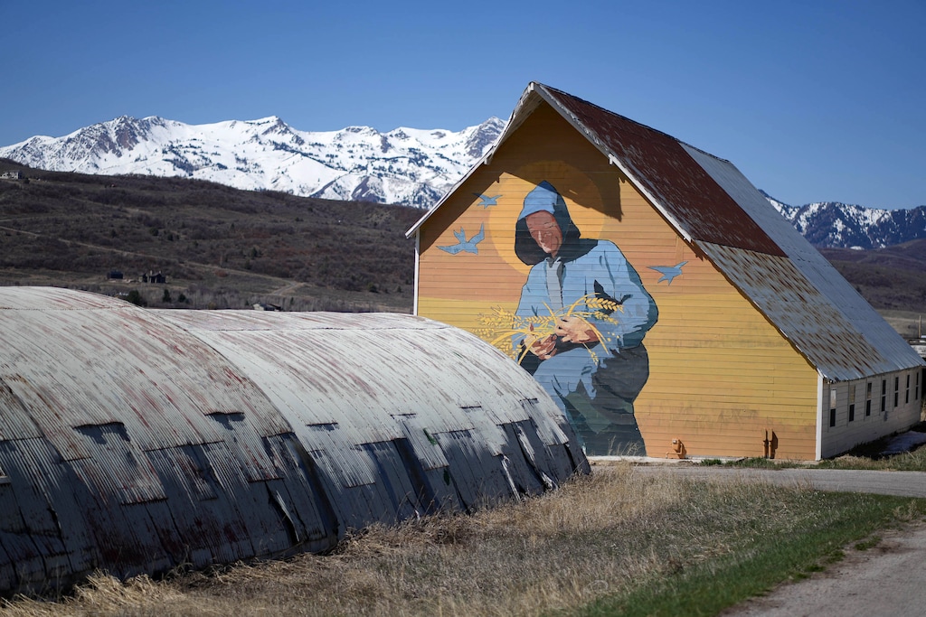 (Francisco Kjolseth | The Salt Lake Tribune) Monk Michael Straham is depicted by area artist Jake Songer on one of the remaining buildings at The Abbey of Our Lady of the Holy Trinity in the rapidly subdividing Ogden Valley. A deal has been reached to preserve most of the 1,800-acre agricultural operation that surrounds the former site. Landowner Bill White has agreed to donate much of the development rights to the land so that it remains as agricultural open space.