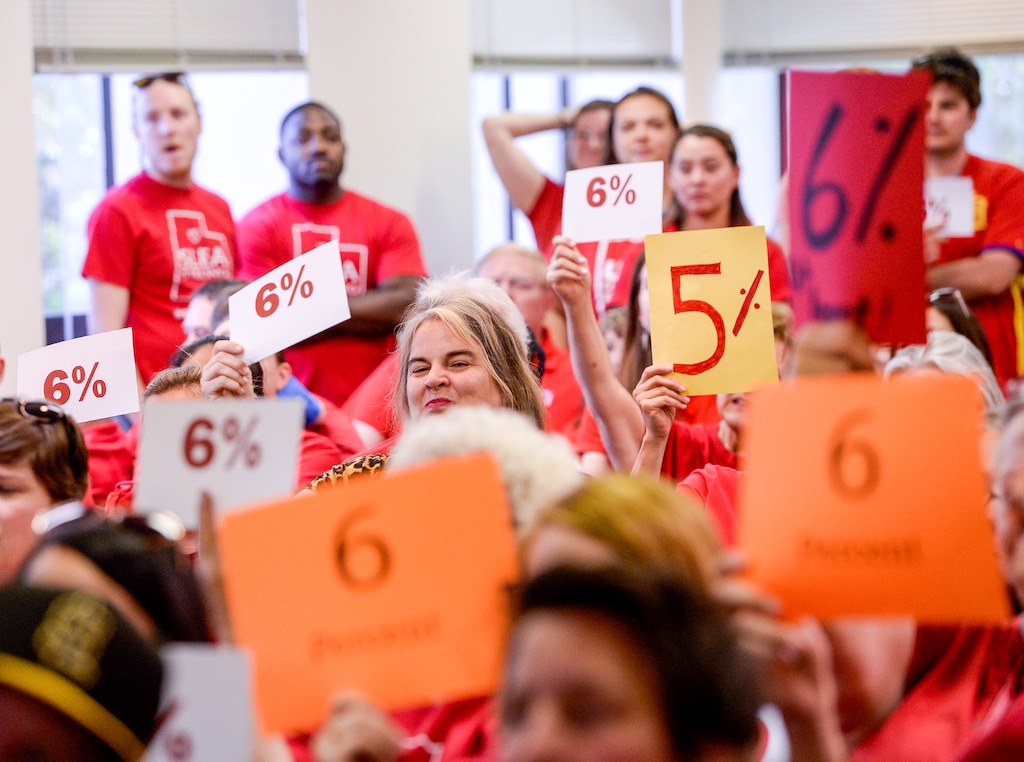 (Leah Hogsten  |  The Salt Lake Tribune) Teachers walk out of the public comment period at the Salt Lake City School District meeting regarding salary negotiations, June 4, 2019.