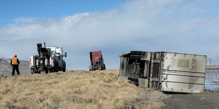 (Al Hartmann  |  The Salt Lake Tribune) 	One of three semi truck trailers that flipped over on I-80 westbound in high winds around 8:00 a.m. Friday March 2.  The incidents happened between mile posts 79 to 82 just east of the Rowley-Dugway exit in Tooele County.   Wrecking crews were kept busy all morning righting the rigs. 