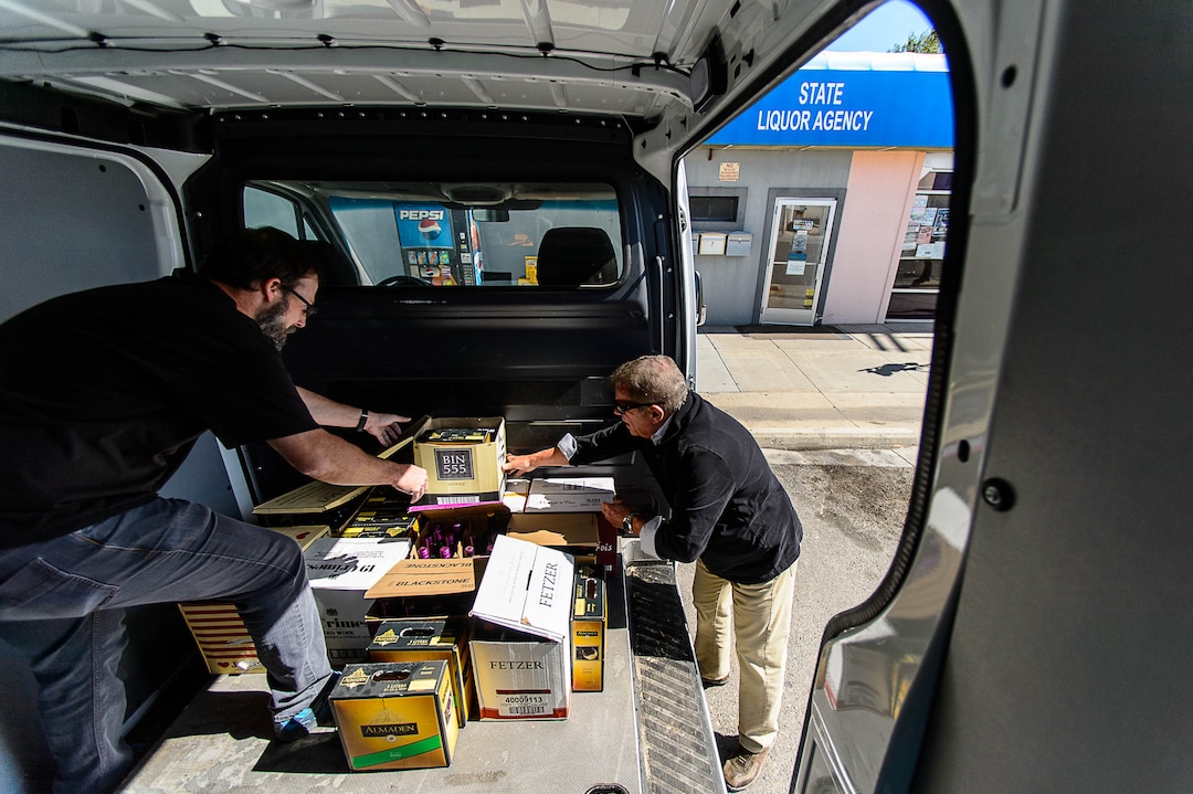 (Trent Nelson | The Salt Lake Tribune)  DABC employees Branden Hirst and Terry Wood remove inventory from the package agency in Tremonton after routine audits showed a string of money losses and consumers lodged repeated complaints about stock availability, Tuesday, Sept. 26, 2017.