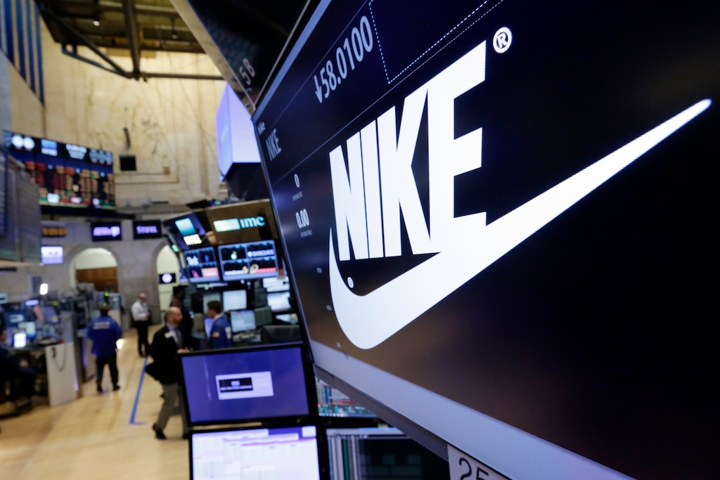 (Richard Drew | The Associated Press) The Nike logo appears above the post where it trades on the floor of the New York Stock Exchange, Wednesday, March 22, 2017. Nike dropped 6 percent after issuing a weak forecast.