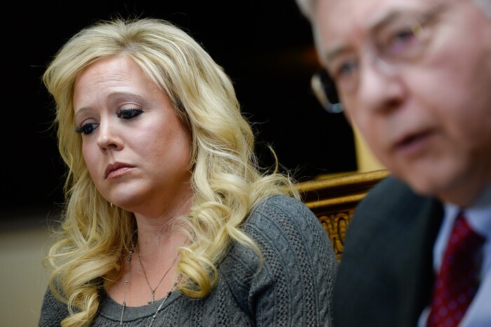 (Francisco Kjolseth | The Salt Lake Tribune) Heather Leyva, listens as her attorney Robert Sykes, discusses the sexual harassment lawsuit he is filing on her behalf against Utah trooper Sgt. Blaine Robbins, during a press conference at his law offices in Salt Lake City Wed. Feb. 7, 2018. According to the lawsuit, the trooper hounded her with unwanted sexually charged messages and used his position and authority to stalk her.