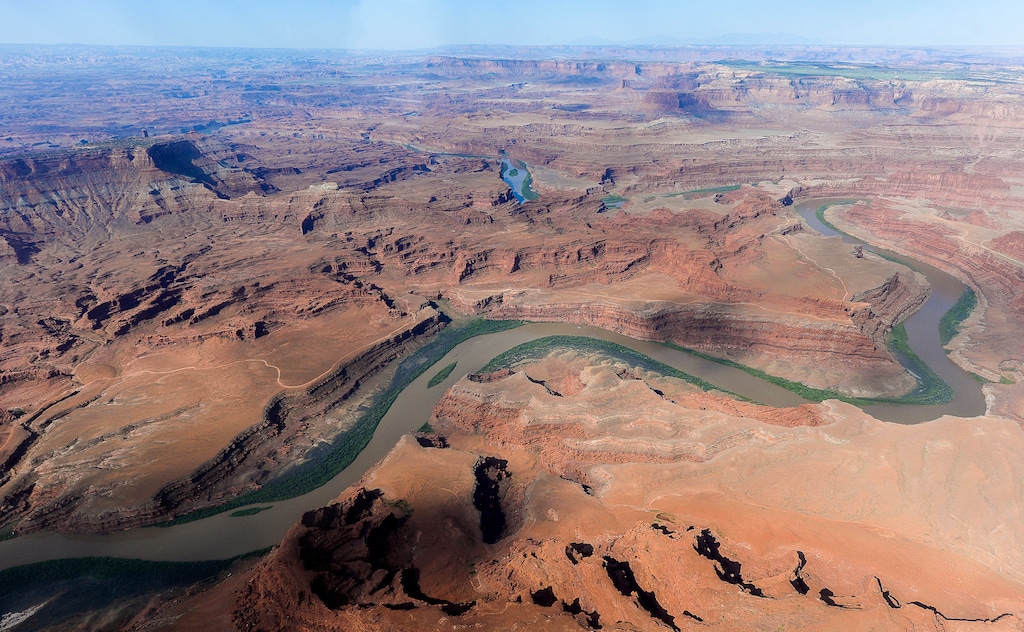 (Francisco Kjolseth  | The Salt Lake Tribune) Looking south beyond the Colorado River, is the northern most boundary of the proposed Bears Ears region in southeastern Utah, which is subject to a possible National Monument designation by President Obama under the Antiquities Act for protection. EcoFlight recently flew journalists, tribal people and activists over the northern portion of the proposed 1.9 million acre site in an effort to push for permanent protection from impacts caused by resource extraction and high-impact public use. 