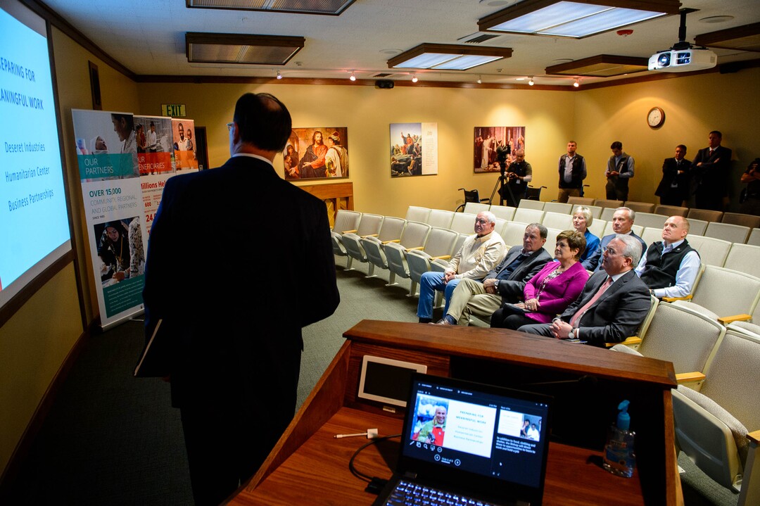 (Trent Nelson  |  The Salt Lake Tribune)  Agriculture Secretary Sonny Perdue on a tour of Welfare Square in Salt Lake City on Wednesday May 22, 2019. From left in front row, Perdue, Gov. Gary Herbert, Jeanette Herbert, and Elder Jack N. Gerard. Presenting is Bishop W. Christopher Waddell.
