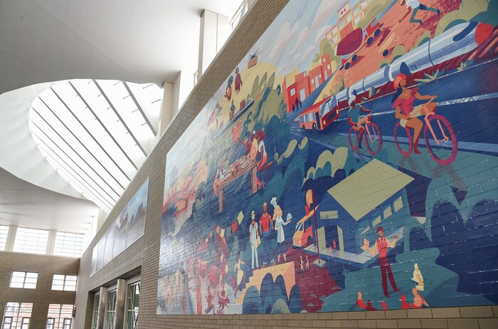 (Francisco Kjolseth  |  The Salt Lake Tribune) Salt Lake City Mayor Jackie Biskupski and Salt Lake County Mayor Jenny Wilson help reveal and dedicate a new legacy mural on Monday, Dec. 30, 2019, placed at the Salt Palace to commemorate the 68thÊUnited Nations Civil Society Conference which took place in Salt Lake City in August. The mural was created by Tooele based Digital Gravy which specializes in 2D design-based animation.