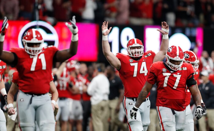 Georgia react after a replay confirmed a touchdown during the second half of the NCAA college football playoff championship game against Alabama Monday, Jan. 8, 2018, in Atlanta. (AP Photo/David Goldman)