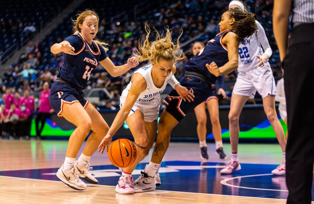 (Rick Egan | The Salt Lake Tribune) BYU guard Paisley Harding (13), Collins with Pepperdine Waves guard Jayla Ruffus-Milner (14), in women's basketball action between the BYU Cougars and the Pepperdine Waves, at the Marriott Center in Provo, on Thursday, Feb. 10, 2022. Judkins scored his 450th win tonight.