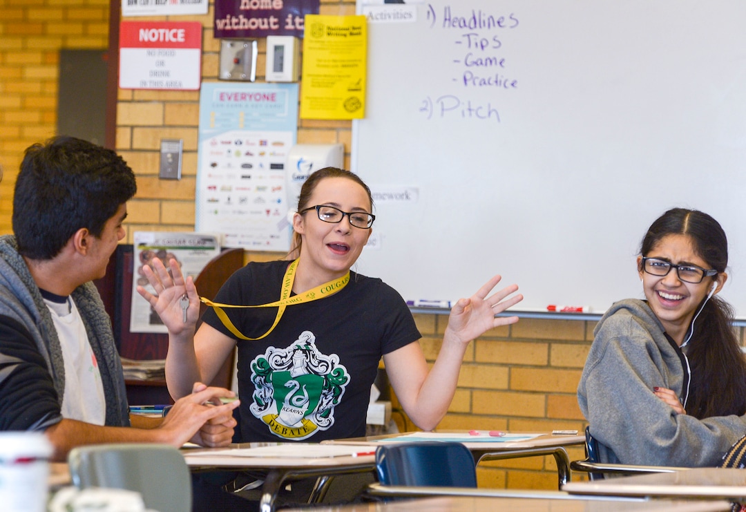 (Leah Hogsten  |  The Salt Lake Tribune) Cougar Claw news editor Dixie Poindexter shares a laugh with her classmates during a discussion about their stories to pitch for the paper. The student newspaper at Kearns High School, The Cougar Claw, is working to become the community newspaper for Kearns.