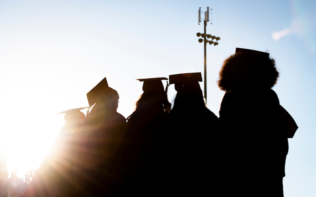 (Isaac Hale | Special to The Tribune) Graduates make their way to their seats on the football field during Herriman High School’s graduation ceremony held Thursday, June 3, 2021.