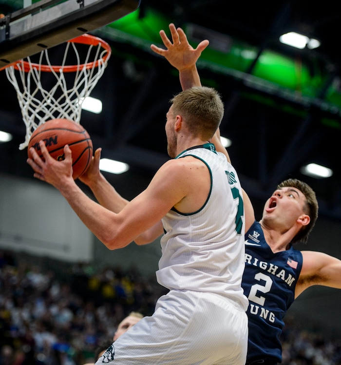 (Steve Griffin  |  The Salt Lake Tribune) Brigham Young Cougars guard Zac Seljaas (2) tries to block the short shot of Utah Valley Wolverines guard Jake Toolson (2) during the BYU versus UVU basketball game at UCCU Center on the UVU campus in Orem Wednesday November 29, 2017.