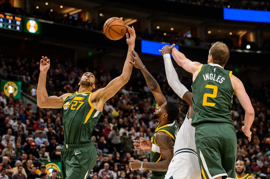 (Trent Nelson | The Salt Lake Tribune)  Utah Jazz center Rudy Gobert (27) pulls in a rebound as the Utah Jazz host the Denver Nuggets, NBA basketball in Salt Lake City on Wednesday Jan. 23, 2019.