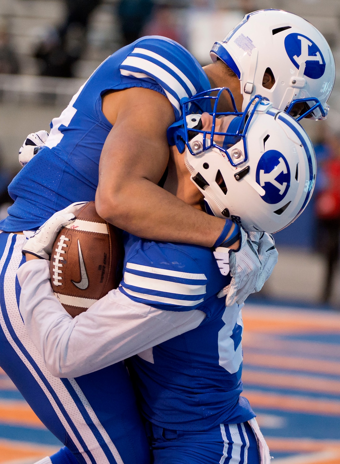 (Jeremy Harmon  |  The Salt Lake Tribune) Brigham Young Cougars running back Riley Burt (34) is hugged by Brigham Young Cougars wide receiver Neil Pau'u (84) after Burt scored a touchdown as BYU faces the Western Michigan Broncos in the Famous Idaho Potato Bowl in Boise, Idaho, on Friday, Dec. 21, 2018.
