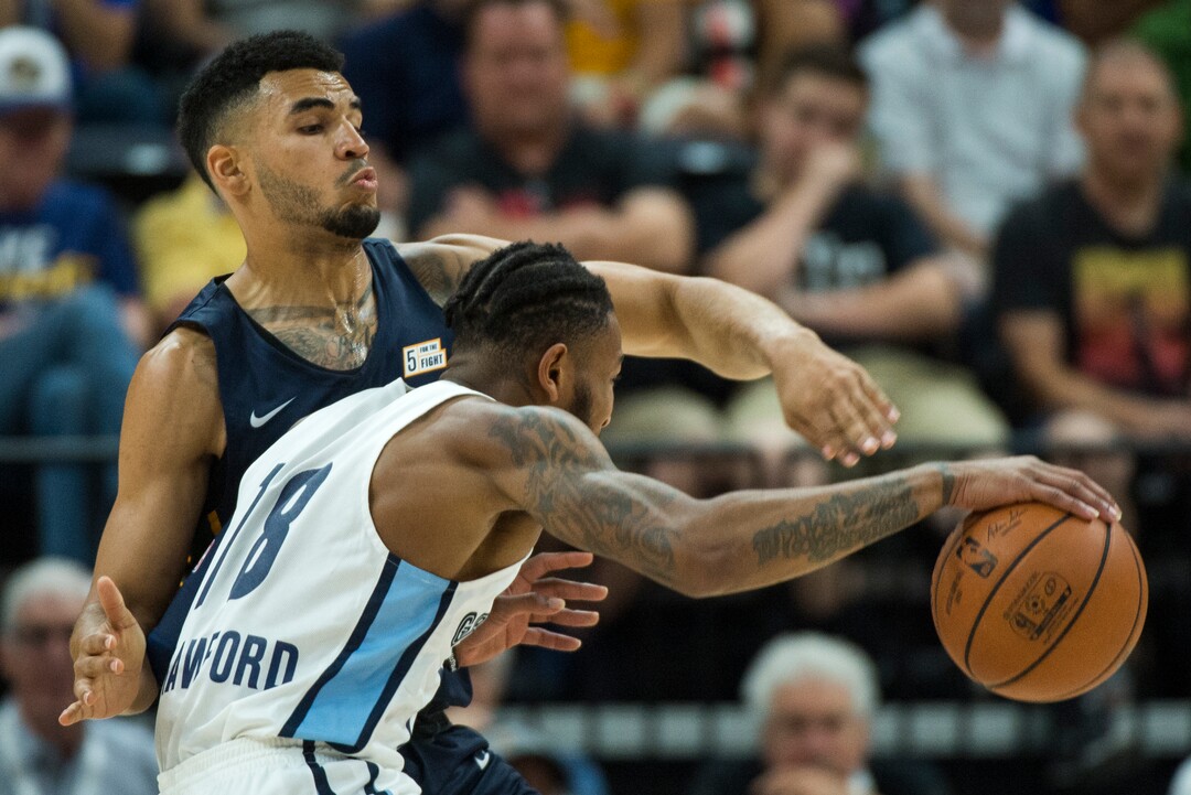 (Rick Egan  |  The Salt Lake Tribune)     Utah Jazz guard Naz Mitrou-Long (30) defends as Memphis Grizzlies guard Markel Crawford (18)drives inside, in Jazz summer league action between Utah Jazz and Memphis Grizzlies in Salt Lake City, Tuesday, July 3, 2018.