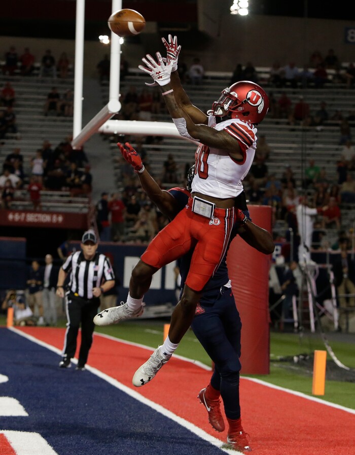 Arizona safety Demetrius Flannigan-Fowles (6) defends the pass intended for Utah wide receiver Siaosi Wilson (80) in the first half during an NCAA college football game, Friday, Sept. 22, 2017, in Tucson, Ariz. Wilson was ruled out of bounds on the play. (AP Photo/Rick Scuteri)