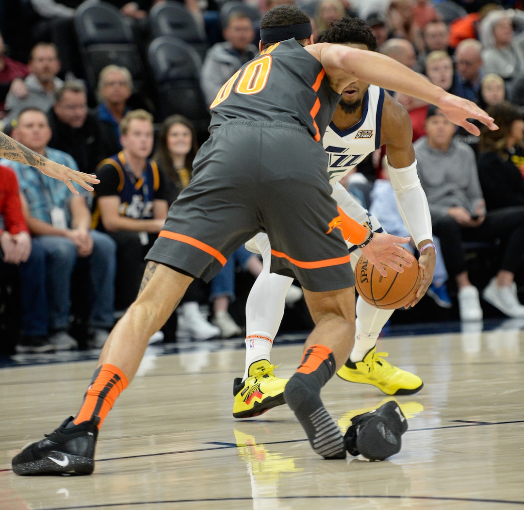 (Francisco Kjolseth  |  The Salt Lake Tribune) Orlando Magic forward Aaron Gordon (00) loses his shoe as Utah Jazz guard Donovan Mitchell (45) gets ready to shoot over him as the Utah Jazz host the Orlando Magic in their NBA basketball game at Vivint Smart Home Arena in Salt Lake City on Tuesday. Dec. 17, 2019.