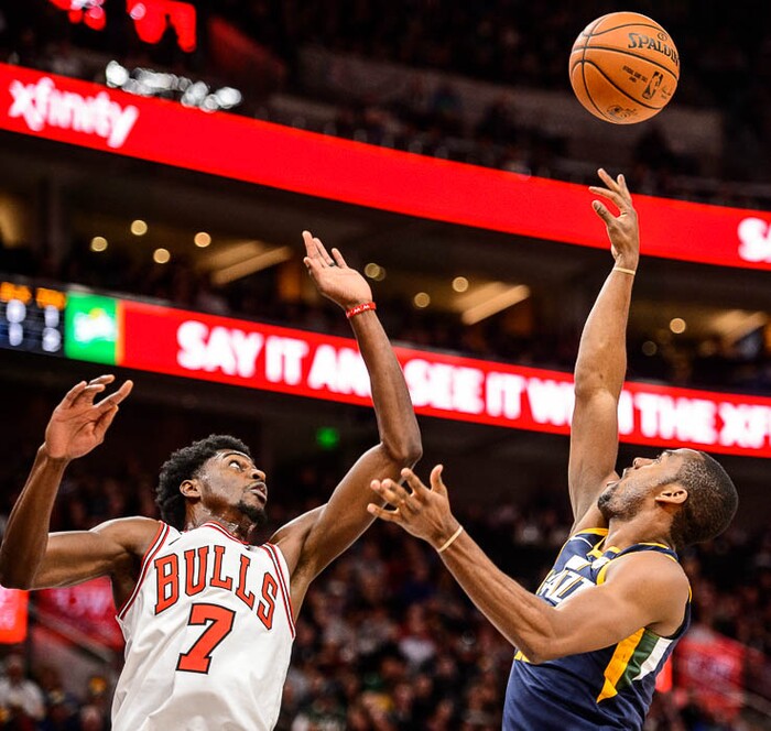 (Trent Nelson | The Salt Lake Tribune)  Utah Jazz guard Alec Burks (10) shoots over Chicago Bulls guard Justin Holiday (7) as the Utah Jazz host the Chicago Bulls, NBA basketball in Salt Lake City Wednesday November 22, 2017.