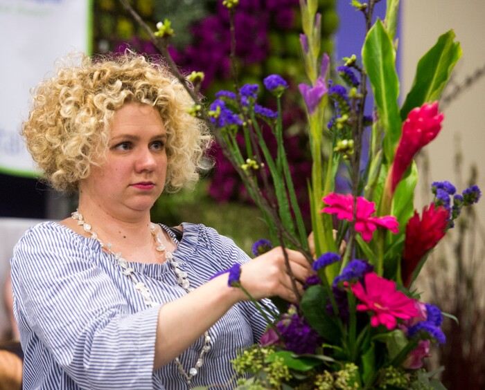 (Rick Egan  |  The Salt Lake Tribune)   Crystal Tatton arranges flowers for the Blooming Hope Flower Auction, benefiting Primary Children's Hospital at the Salt Lake Tribune Home & Garden show, at the Mountain America Expo Center in Sandy, Saturday, March 10, 2018.