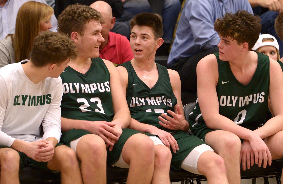 (Leah Hogsten  |  The Salt Lake Tribune) Olympus' l-r Harrison Creer, Rylan Jones and Jeremy DowDell share a laugh after the starter were taken out in the remaining minutes of the game. Olympus High School defeated Highland High School 86-54 during their basketball game, Tuesday, February 6, 2018.
