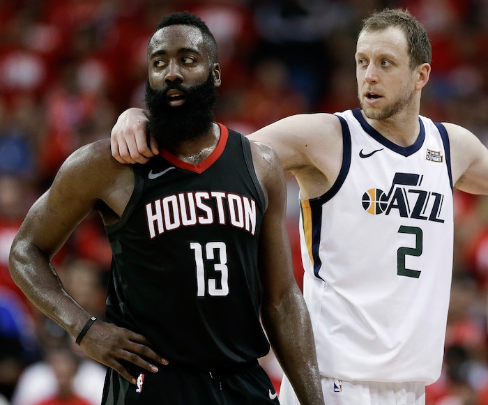 Houston Rockets guard James Harden (13) and Utah Jazz forward Joe Ingles wait during a timeout in the second half in Game 2 of an NBA basketball second-round playoff series, Wednesday, May 2, 2018, in Houston. (AP Photo/Eric Christian Smith)