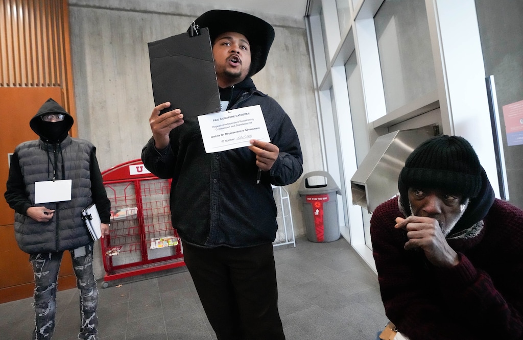 (Francisco Kjolseth | The Salt Lake Tribune) Paid signature gatherers reach out to Utah voters at the University of Utah Marriott Library in the effort to repeal Prop 4, the 2018 voter-approved ballot initiative on redistricting, on Thursday, Jan. 8, 2026.
