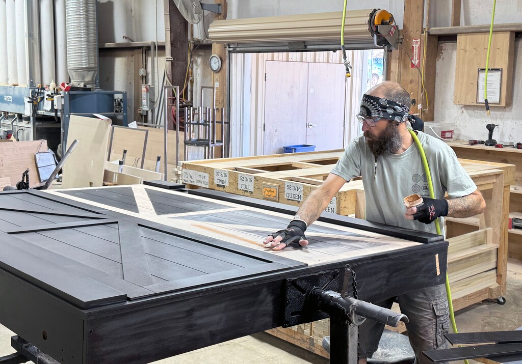 (Mark Eddington | The Salt Lake Tribune) Employees in the factory building beds at Wilding Wallbeds in St. George, Monday, Nov. 24, 2025.