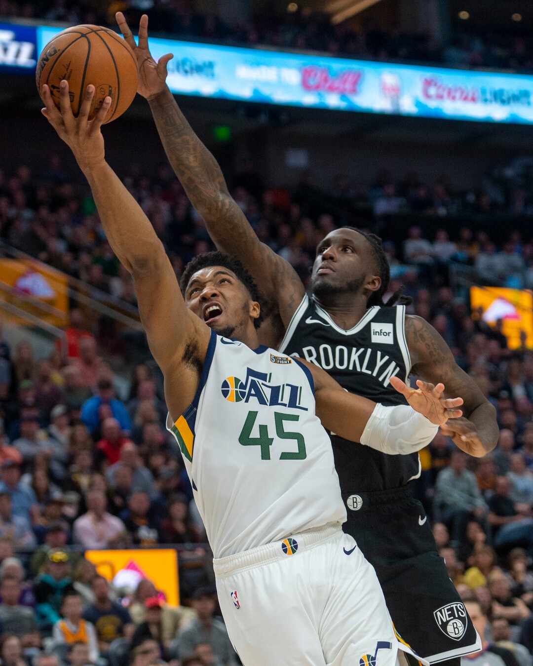 (Rick Egan  |  The Salt Lake Tribune)        Utah Jazz guard Donovan Mitchell (45) scores as Brooklyn Nets guard Spencer Dinwiddie (8) defends, in NBA basketball action between the Utah Jazz and the Brooklyn Nets in Salt Lake City, Tuesday, Nov 12, 2019.