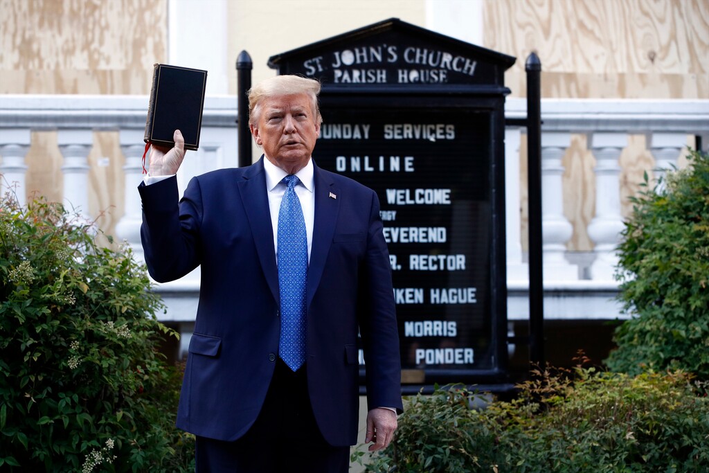 (AP Photo/Patrick Semansky) President Donald Trump holds a Bible as he visits outside St. John's Church across Lafayette Park from the White House Monday, June 1, 2020, in Washington. Part of the church was set on fire during protests on Sunday night.