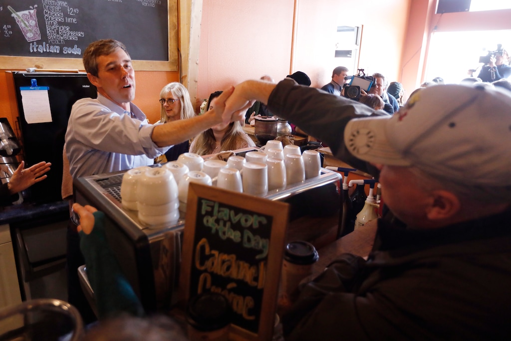 Former Texas congressman Beto O'Rourke greets an audience member during a stop at the Central Park Coffee Company, Friday, March 15, 2019, in Mount Pleasant, Iowa. O'Rourke announced Thursday that he'll seek the 2020 Democratic presidential nomination. (AP Photo/Charlie Neibergall)