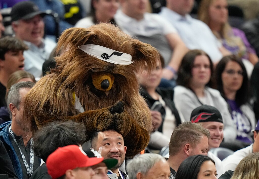 (Francisco Kjolseth  |  The Salt Lake Tribune) The Jazz Bear messes around with a fan as the Utah Jazz host the Cleveland Cavaliers at the Delta Center in Salt Lake City on Tuesday, April 2, 2024.