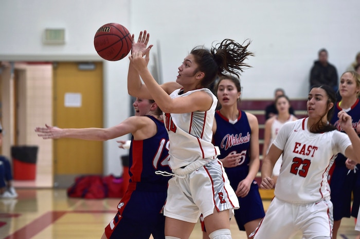 (Scott Sommerdorf   |  The Salt Lake Tribune)   East's Rae Falatea grabs a rebound during first half play. East beat Woods Cross 50-36, Friday, December 15, 2017.  