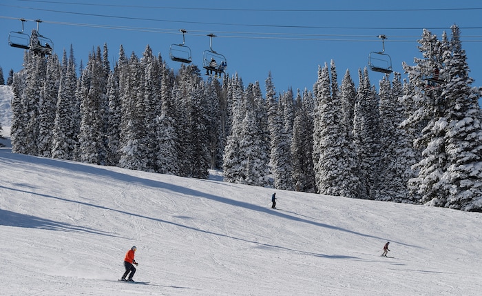 (Francisco Kjolseth  |  The Salt Lake Tribune)  People enjoy a blue bird day at Solitude Mountain Resort following a series of storms that have piled on the inches of snow in the high country on Thursday, Feb. 7, 2019.
