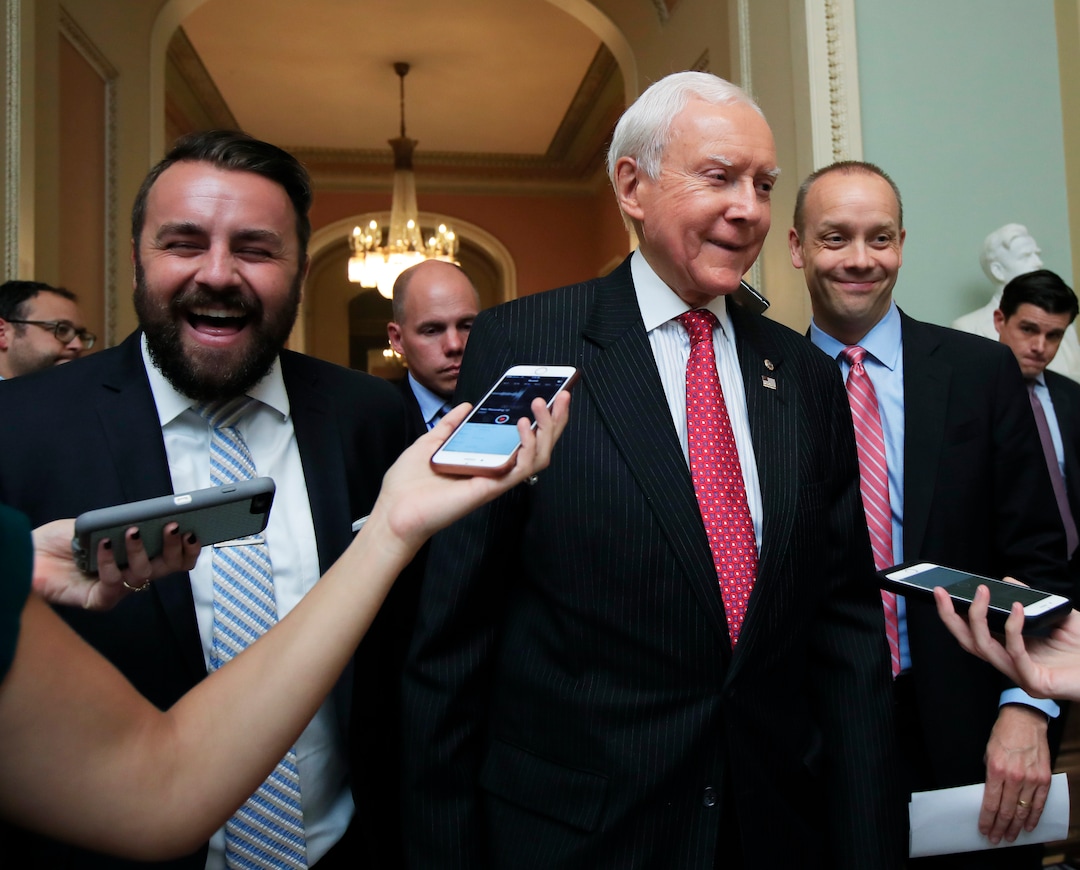 (Manuel Balce Ceneta  |  AP Photo)  Sen. Orrin Hatch, R-Utah, is surrounded by reporters as he walks towards the Senate floor on Capitol Hill in Washington, Monday, July 17, 2017.