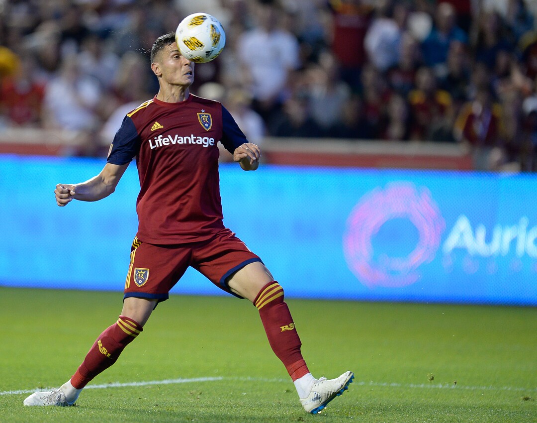 (Francisco Kjolseth  |  The Salt Lake Tribune)  Real Salt Lake midfielder Damir Kreilach (6) gets the ball over Los Angeles Galaxy goalkeeper David Bingham (1) before heading it in for his first goal during the first half of the MLS soccer match Saturday, Sept. 1, 2018, in Sandy at Rio Tinto Stadium.