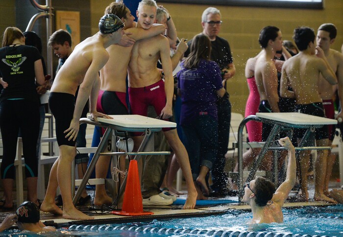 (Francisco Kjolseth  |  The Salt Lake Tribune)  Desert Hills celebrates their win in the Men 200 Yard Medley Relay at the high school swimming 4A State Championships in Bountiful, Friday February 9, 2018.