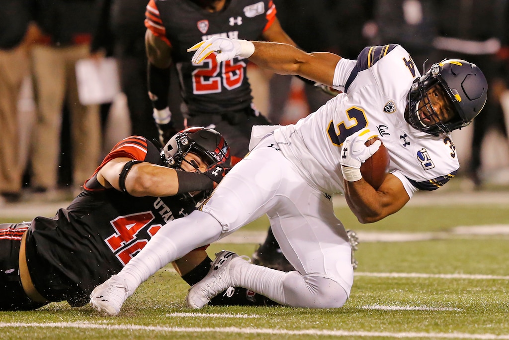 (Rick Bowmer | The Associated Press) Utah defensive end Mika Tafua (42) tackles California running back Christopher Brown Jr. (34) in the first half of an NCAA college football game Saturday, Oct. 26, 2019, in Salt Lake City.