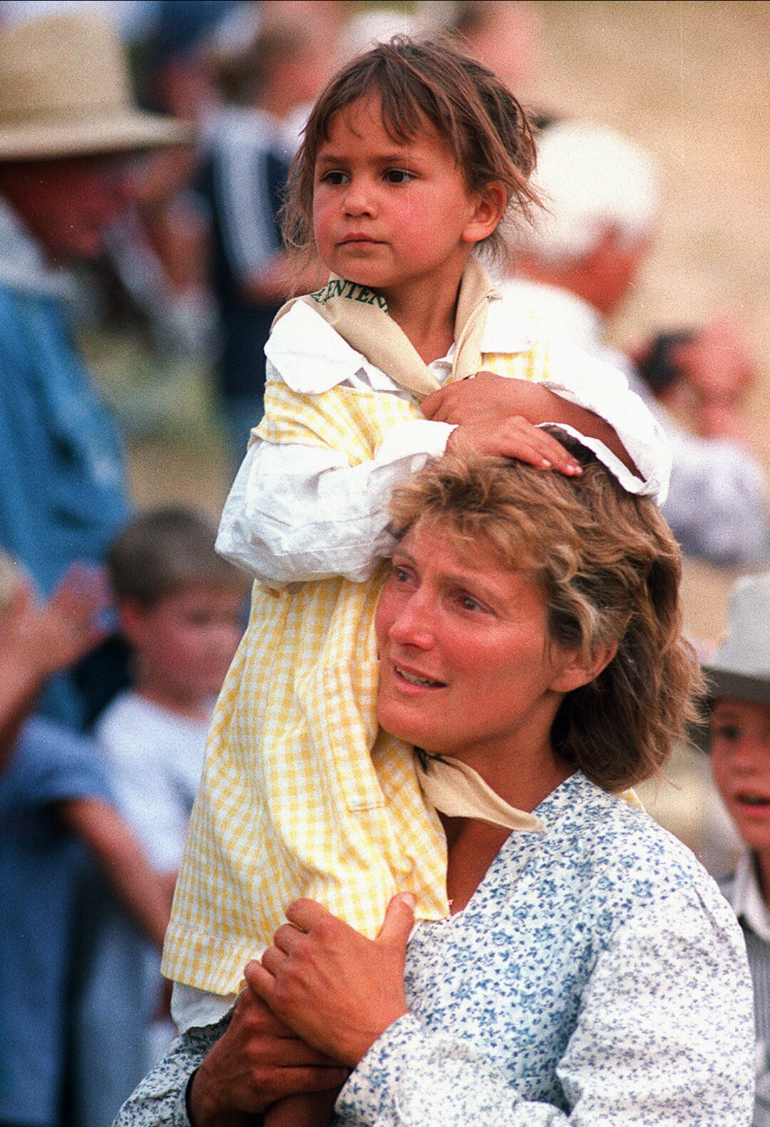 Rick Egan  | Tribune File Photo Nanc' Adams, is moved to tears as she carries her 4-year-old daughter Jackie on her shoulders as she enters the "This is the Place State Park" on July 22, 1997.