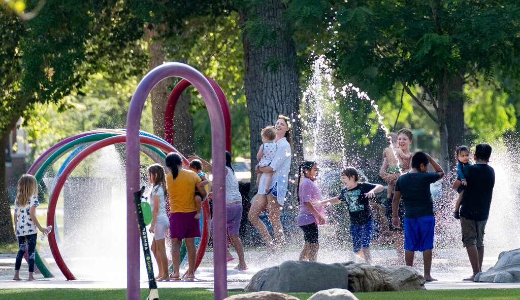 (Francisco Kjolseth | The Salt Lake Tribune) People cool down at Liberty Park on Wednesday, July 7, 2021.