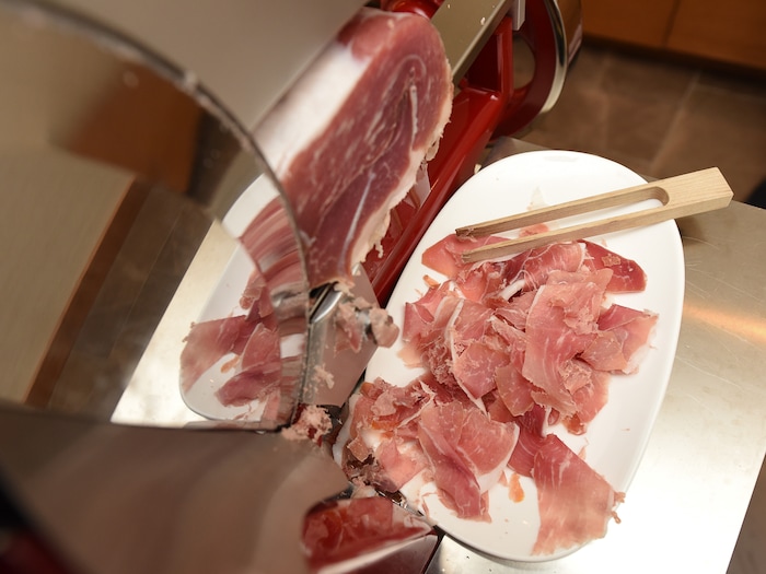 (Francisco Kjolseth  |  The Salt Lake Tribune)  The new AC Hotel in Salt Lake City has a $10,000 Berkel prosciutto slicer. Fire Engine red with chrome trim and a fly wheel that turns manually, it cuts the prosciutto paper thin for the hotel's daily continental breakfast.