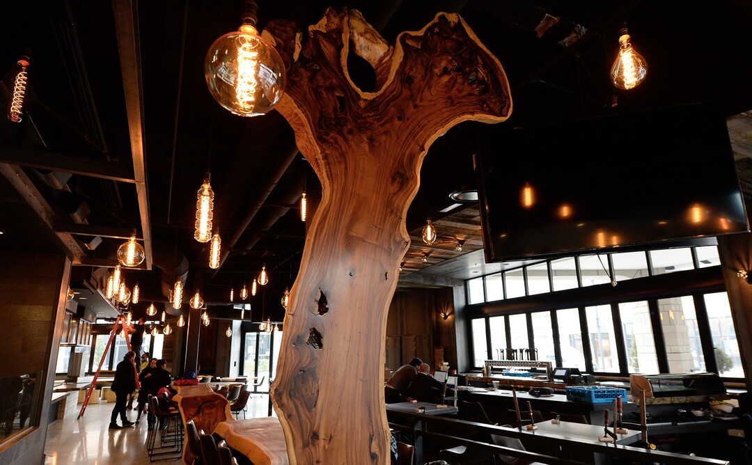 (Francisco Kjolseth  |  The Salt Lake Tribune)  The Gateway is getting a new food hall called HallPass and will be operated by SkinnyFATS, a Las Vegas-based restaurant. Featuring long communal tables made from acacia wood, and murals by artist Donovan Fitzgerald, it features different food options. The Hall also has a full service liquor license which means customers can get beer, wine and spirits if they order food.