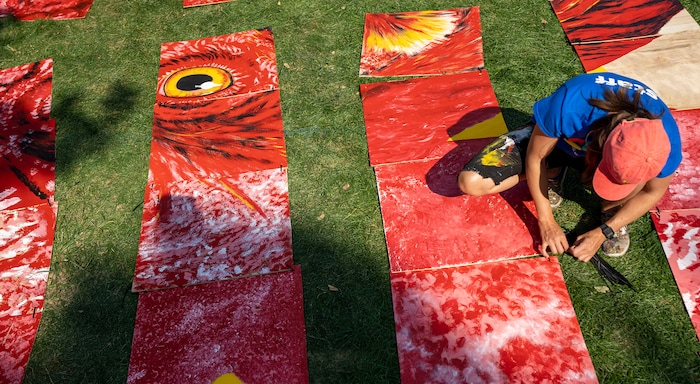 (Rick Egan | The Salt Lake Tribune)  Alexis Rose works on the PZLMRL, where 100 artists painted 100 squares to make a puzzle mural, at the Salt Lake Arts Festival, on Saturday, Aug. 28, 2021.