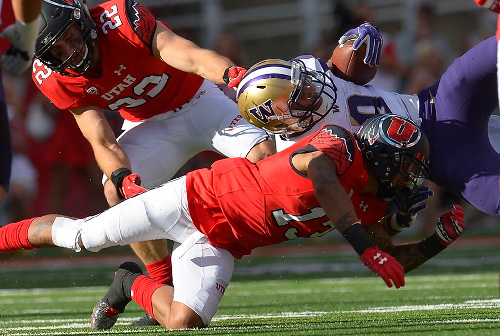 Leah Hogsten  |  The Salt Lake TribuneWashington Huskies running back Myles Gaskin (9) is brought down by Utes defensive back Jordan Fogal (13). University of Washington Huskies defeated University of Utah Utes 31-24 at Rice-Eccles Stadium, Saturday, October 29, 2016.