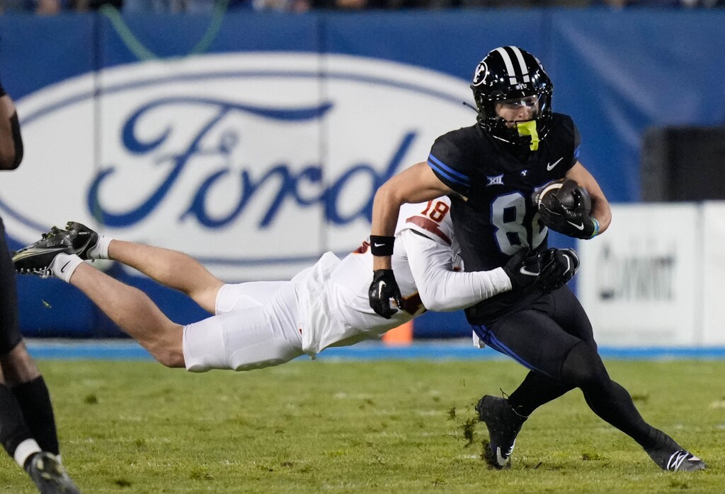 (Francisco Kjolseth  |  The Salt Lake Tribune) Brigham Young Cougars wide receiver Parker Kingston (82) is grabbed by Iowa State Cyclones defensive back Ben Nikkel (18) during an NCAA college football game on Saturday, Nov. 11, 2023, in Provo, Utah.