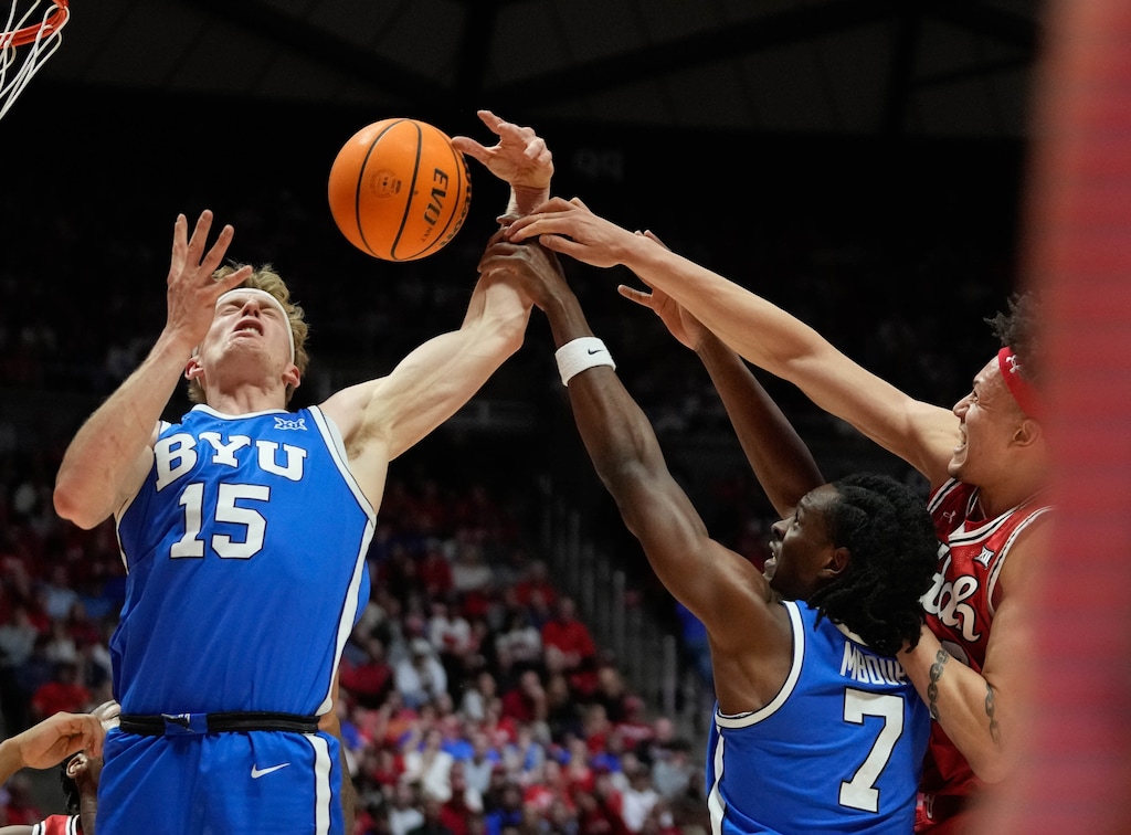 (Francisco Kjolseth | The Salt Lake Tribune) BYU Cougars guard Richie Saunders (15) battles for a rebound as Utah hosts BYU, NCAA basketball in Salt Lake City on Saturday, Jan. 10, 2026.