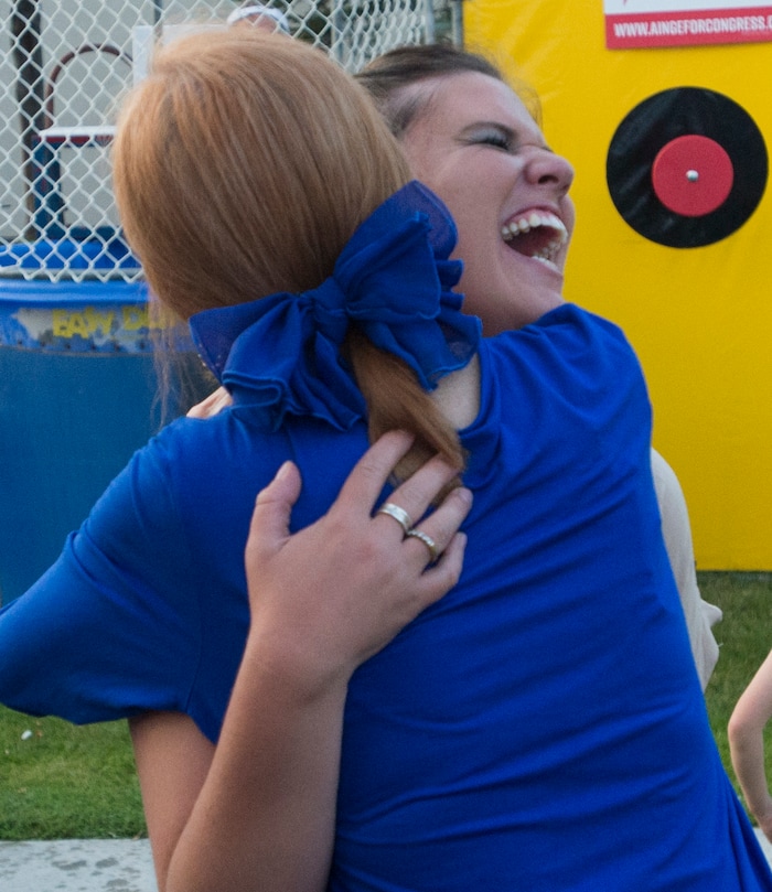 (Rick Egan  |  The Salt Lake Tribune)  Aubrey Farnsworth gets a hug from Denise Warner to celebrate Farnsworth dunking Danny Ainge in a dunking booth, during a fundraiser in Provo for Tanner Ainge, who is running for congress, in Utah’s third district. Monday, August 7, 2017.