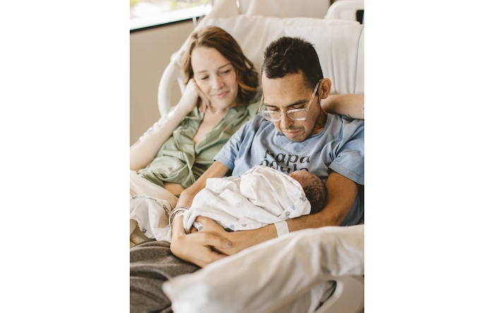 (GoFundMe) Shay Wright and Tanner Martin hold their newborn daughter, Amy Lou. Martin, who chronicled his battle with cancer and Shay's pregnancy for thousands of social-media followers, died June 25, 2025, at age 30.